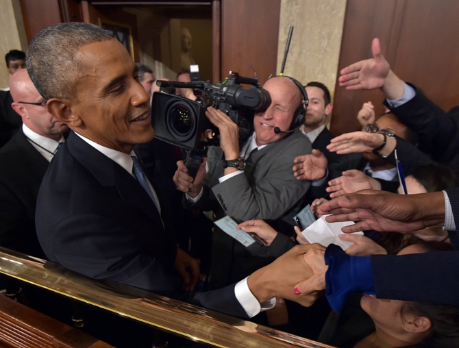 US President Barack Obama (left) shakes hands after he delivered his State of the Union address to a joint session of Congress on Capitol Hill in Washington. Mandel Ngan/Pool/Reuters