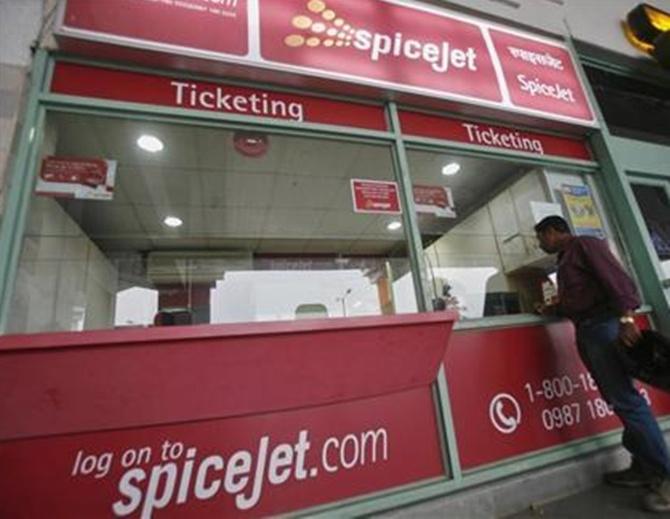 A passenger stands outside the SpiceJet Airlines ticket counter at the domestic airport on the outskirts of Agartala.