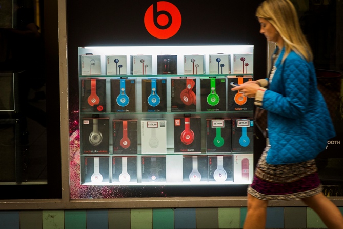 A pedestrian walks past a Beats brand display in the subway system of New York. Lucas Jackson/Reuters