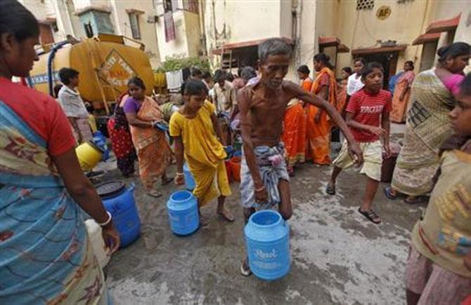 Residents of a free-housing colony are forced to buy water from a commercial tanker because of shoddy supply piping in their buildings