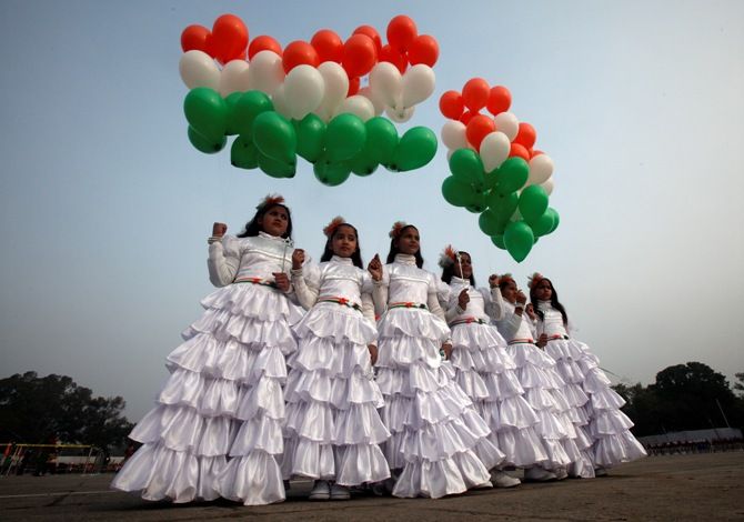 School children holding tri-coloured balloons take part in the Republic Day celebrations in Chandigarh. 
