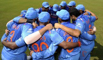 Indian players in a huddle