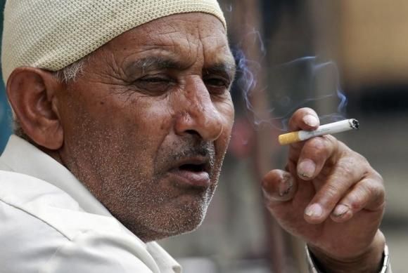A man smokes a cigarette