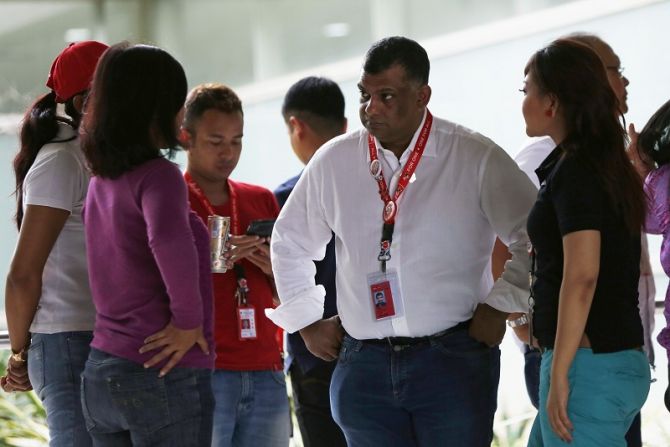 AirAsia chief Tony Fernandes talks to his staff. Photograph: Reuters