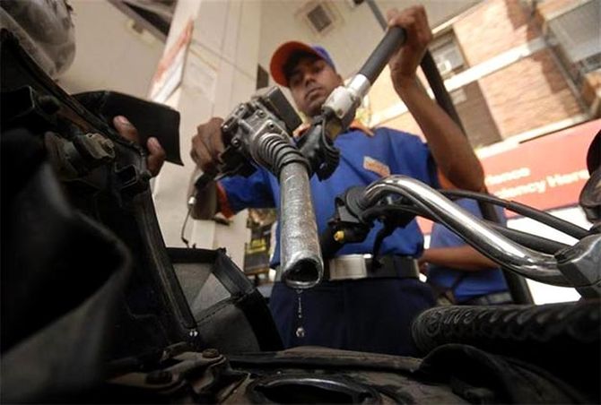 A petrol pump staff at work.