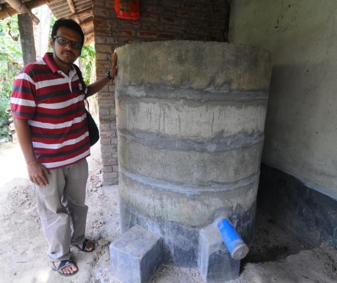 Abhishek Singhania poses with a rice storage container