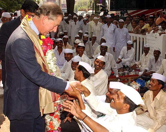 Prince Charles and now King Charles III with dabbawalas in 2015