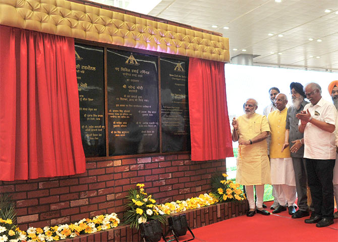 Prime Minister Narendra Modi inaugurates the New Civil Air Terminal, at Chandigarh airport on September 11, 2015. Governor of Punjab and Haryana and Administrator, Union Territory, Chandigarh, Professor Kaptan Singh Solanki, Chief Minister of Punjab Prakash Singh Badal, Chief Minister of Haryana Manohar Lal Khattar, Union Minister for Civil Aviation Ashok Gajapathi Raju Pusapati and other dignitaries are also seen.