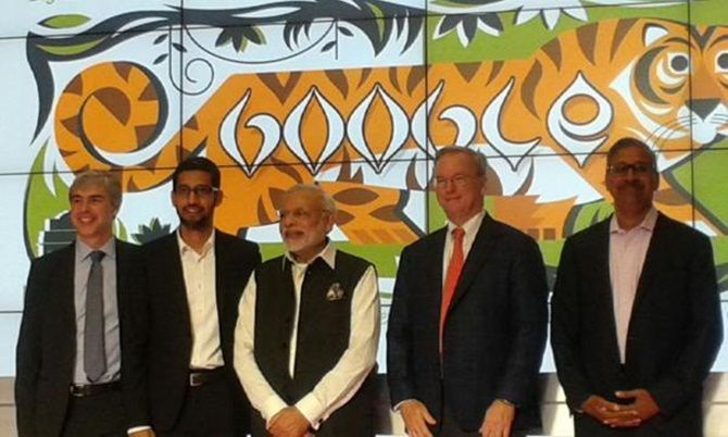 Prime Minister Narendra Modi at the Google headquarters, flanked by Google CEO Sunder Pichai and former Google CEO Eric Schmidt. On the right is early Google investor Ram Shriram, and on the left, Google co-founder and Chairman Larry Page.