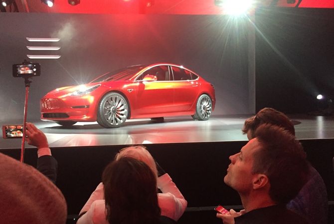 A Tesla Model 3 sedan, its first car aimed at the mass market, is displayed during its launch in Hawthorne, California, March 31, 2016. 