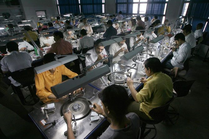 Employees at a diamond cutting and polishing factory in Surat