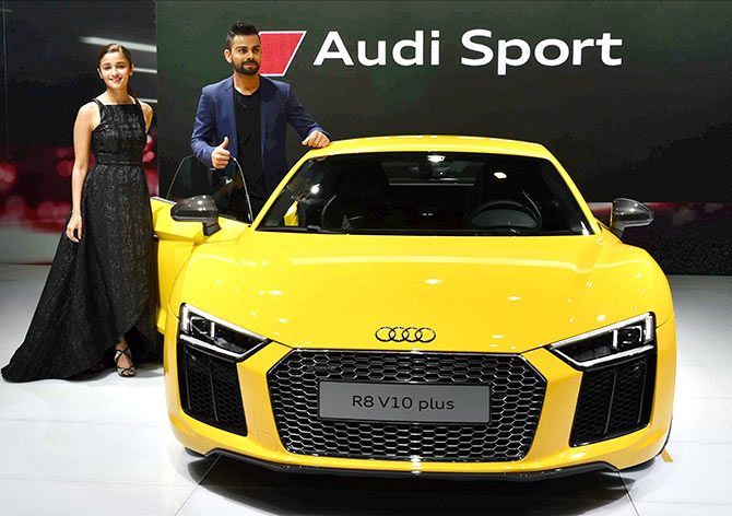 Virat Kohli and Alia Bhatt at the launch of Audi's sports car R8 V10 in 2019. Audi has been in talks with the Swiss-based Sauber Group, whose team competes under the Alfa Romeo name, according to reports by Reuters and other media.