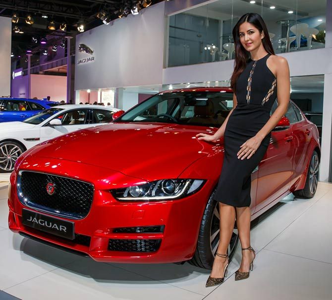Actress Katrina Kaif poses with a Jaguar car