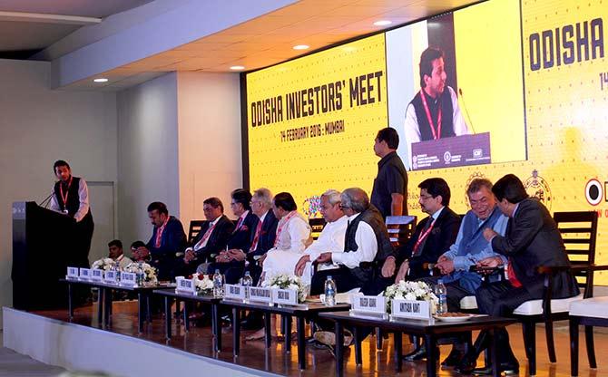 Ritesh Agarwal (extreme left), founder, OYO Rooms, speaks about his vision for Odisha's start ups as T V Narendran (third), Managing Director, Tata Steel, Y C Deveshwar (fifth), Chairman, ITC, Naveen Patnaik, Odisha chief minister (centre), Bibek Debroy, economist and member, NITI Aayog, Kumarmangalam Birla, Chairman, Aditya Birla Group, Shashi Ruia of Essar Group listen to his speech.