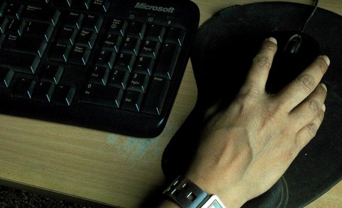 A woman works on a computer