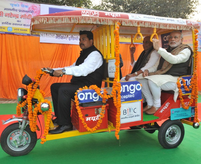 Prime Minister Narendra Modi takes a ride in an E-Rickshaw in Lucknow, January 22, 2015. Photograph: Press Information Bureau