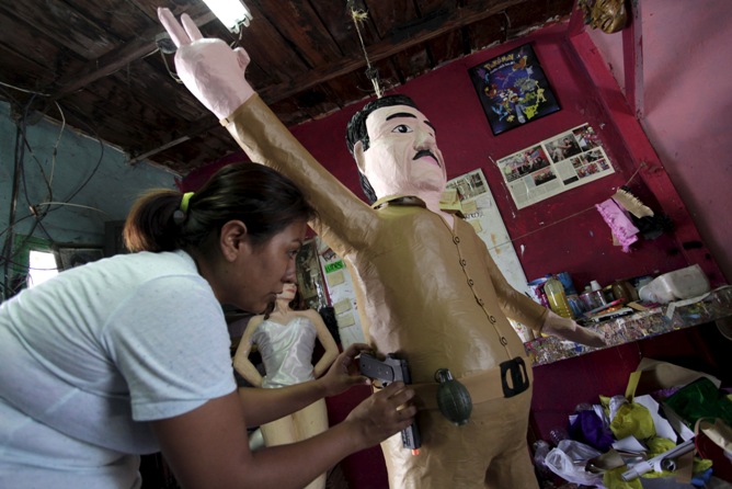 Workers make stuffed dolls which are to exported to Europe and north America, at a factory in Lianyungang, Jiangsu province, China.