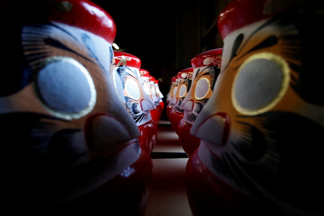 Workers make stuffed dolls which are to exported to Europe and north America, at a factory in Lianyungang, Jiangsu province, China.