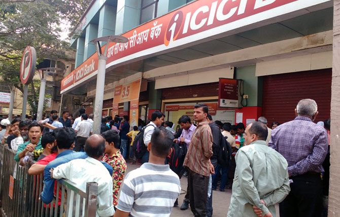 Raksha Ram, who was standing in this long queue said that the ATM machine (red shutter, extreme right) had stopped working since 9.30 in the morning when he just joined the big line.