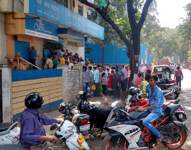 Unlike yesterday, the crowd outside this Bank of Mahrashtra had spilled on to the road.