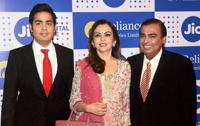 Akash, Nita and Mukesh Ambani