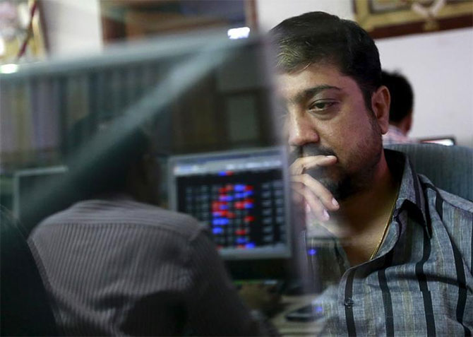 Markets close on mixed note; Sensex slides, Nifty gains