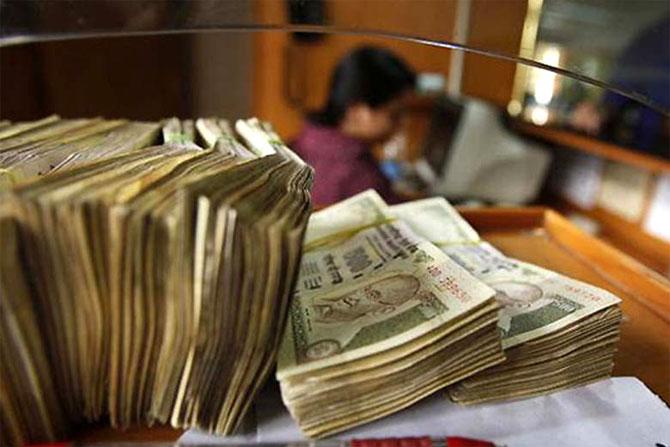 Rupee soars to 2 week high on shaky dollar easing CAD Rediff