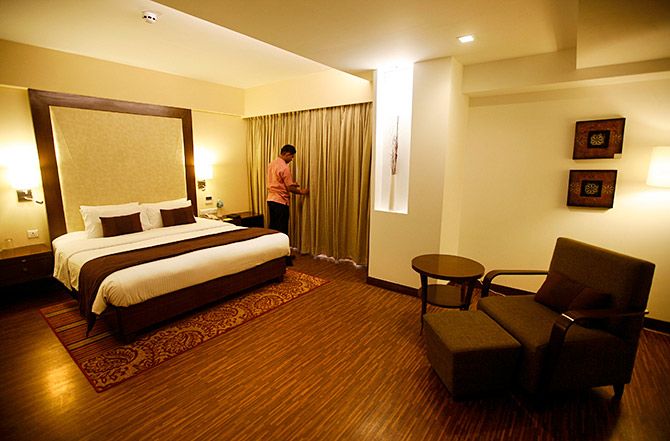 An employee prepares a room at the Four Points hotel, Ahmedabad, April 9, 2013. Photo: Amit Dave/Reuters