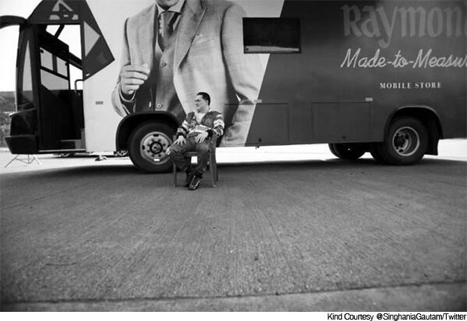 Gautam Singhania, chairman of Raymonds, sitting outside of a Raymond Made to Measure mobile store. Photo: Kind Courtesy @SinghaniaGautam