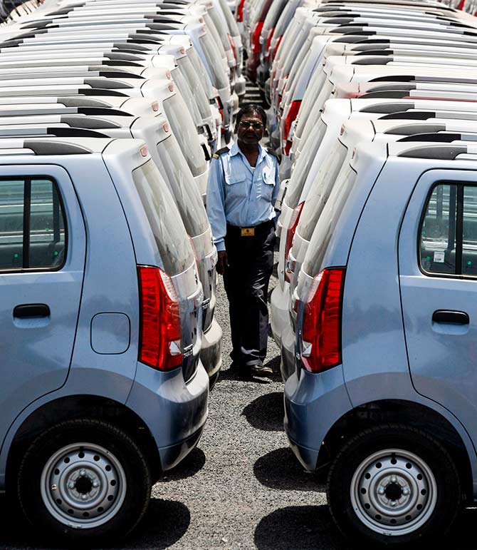 A security personnel officer walks at a Maruti Suzuki stockyard on the outskirts of the western Indian city of Ahmedabad April 26, 2010. Photo: Amit Dave/Reuters