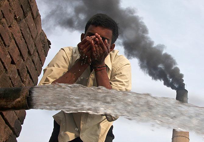 A brick factory spews smoke