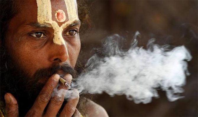 A sadhu smoking a bidi