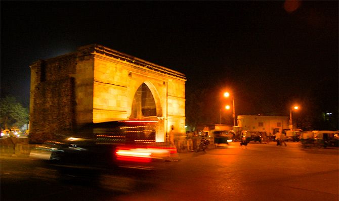 The walled city that Ahmed Shah built in 1411 AD had 12, or some say, 16 or 21 gates. This is Astodiya Gate by night. With three stone arches and once three guns, it is made from iron-plated timber. It stands 17 feet wide and 25 feet high. Photograph: Kind Courtesy Manishjogi/Wikimedia Commons. 