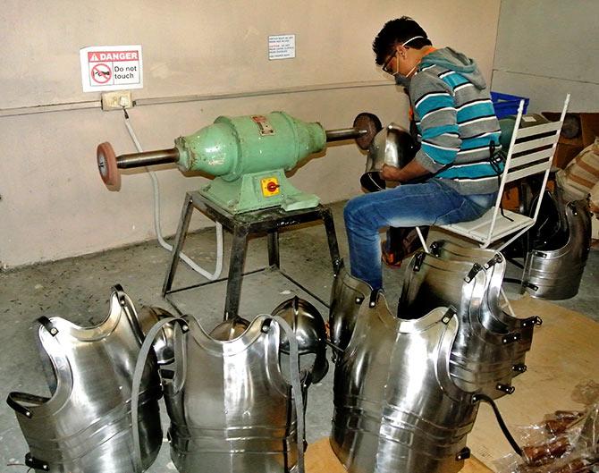 A craftsmen makes chest armour