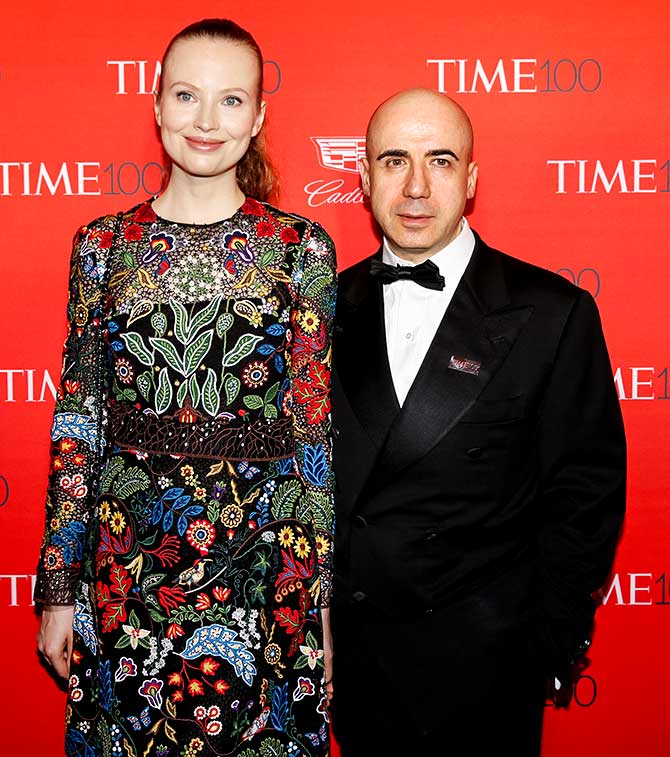 Yuri Milner, founder of DST Global, poses with an unidentified woman friend on the red carpet as they arrive for the TIME 100 Gala in Manhattan, New York, April 26, 2016. Photo: Shannon Stapleton/Reuters