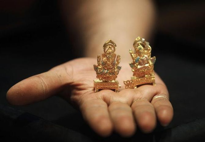 Gold Futures Rise Rs 42 to Rs 61,664/10 gm - PTI