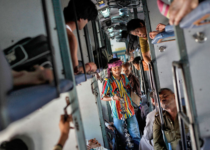 A man sells locks and chains inside a compartment of the Kalka Mail passenger train on the way to Kolkata March 20, 2012. Photo: Danish Siddiqui/Reuters 