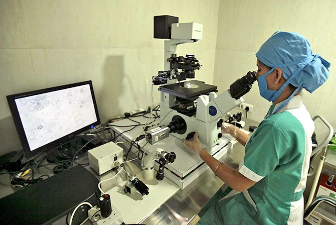 A nurse works on a micromanipulator machine (used for fertilization) at Fortis Bloom Fertility and IVF Centre inside the Fortis hospital at Mohali,Punjab. Photograph: Ajay Verma/Reuters