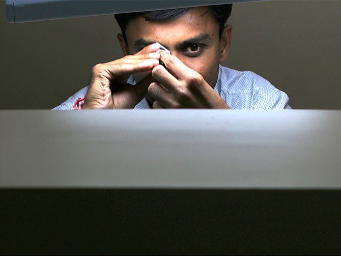 An employee works at a diamond cutting and polishing factory in Surat in the western Indian state of Gujarat March 3, 2009. Photograph: Arko Datta/Reuters.