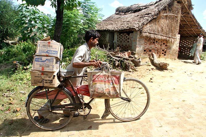 A wholesaler distributes his goods. Photograph: Pawan Kumar/Reuters.