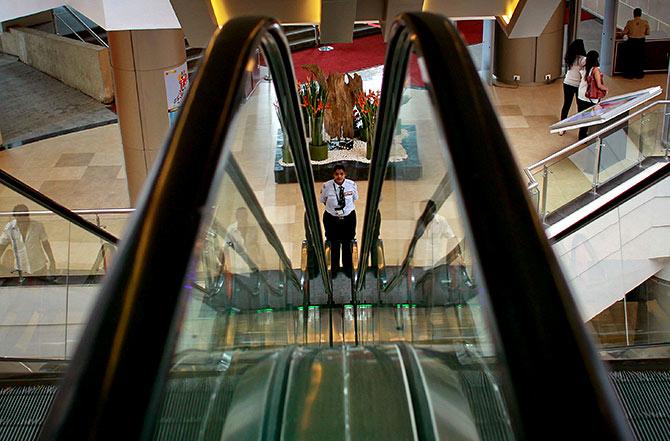 A security guard at a mall in Mumbai. Photograph: Danish Siddiqui/Reuters