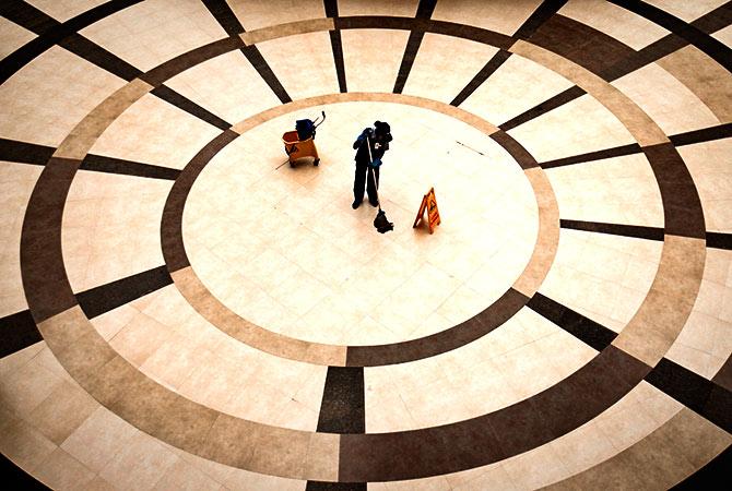 Housekeeping at a mall in Mumbai. Photograph: Danish Siddiqui/Reuters.