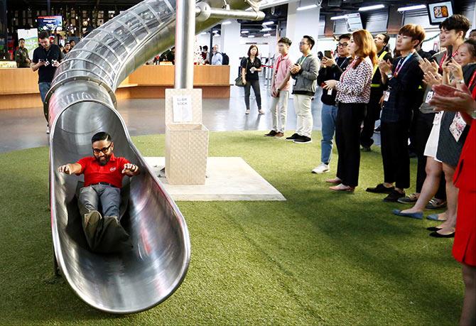 Then AirAsia CEO of Malaysian Operations Riad Asmat makes an entrance during a news conference at AirAsia headquarters in Sepang, Malaysia. Photograph: Lai Seng Sin/Reuters.