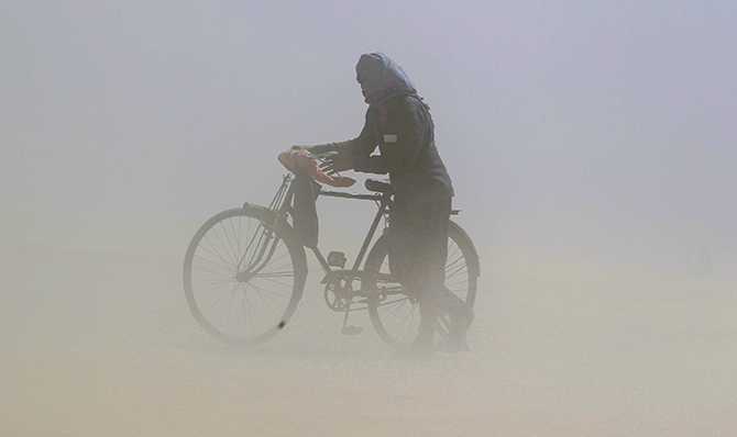 A duststorm on the banks of the Ganga, Allahabad, Uttar Pradesh. Photograph: Jitendra Prakash/Reuters.