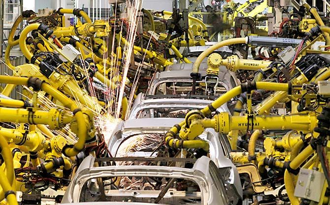 Robotic machines weld bodies of Kia cars in its factory in Zilina, 200 kilometres north of Bratislava October 3, 2012. Photograph: Petr Josek/Reuters.  