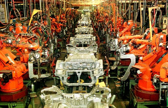 Robots and dozens of car chassis sit idley on an assembly line in Ulsan, South Korea's Hyundai Motors plant. Photograph: Reuters.
