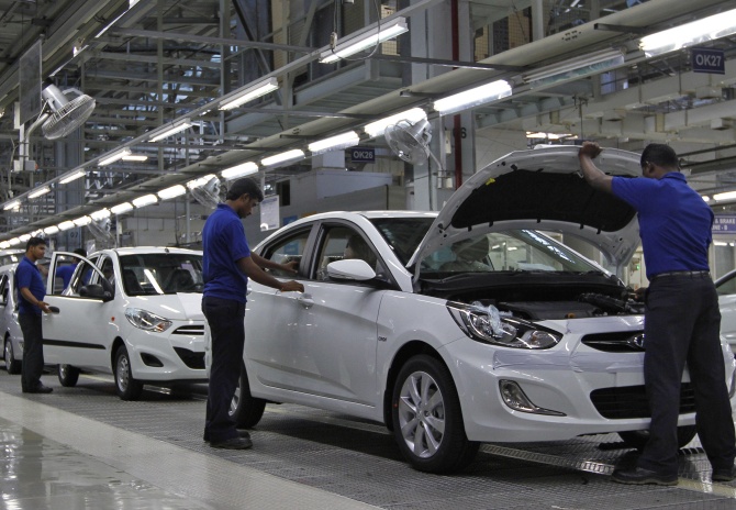 Workers assemble cars inside the Hyundai Motor India Ltd. plant at Kancheepuram district in the southern Indian state of Tamil Nadu. Photograph: Babu/REUTERS