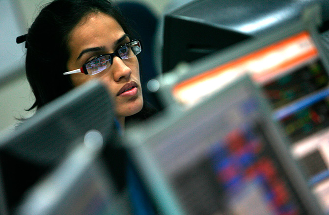 A broker reacts while trading at his computer terminal at a stock brokerage firm in Mumbai, India, February 26, 2016. Indian bonds, shares and the rupee gained on Friday after a key government report on the economy was seen as calling for fiscal prudence and stable inflation, while also acknowledging risks to the growth outlook. Photograph: Shailesh Andrade/Reuters.