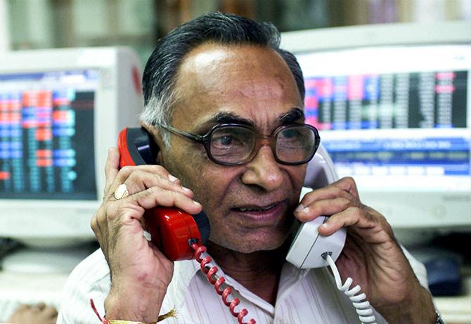 A stock broker trades in Bombay, India's financial capital. Photograph: Savita Kirloskar/Reuters.