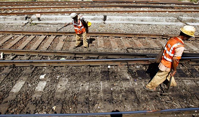 Keyman conduct routine maintenance of railway tracks in Mumbai. Photograph: Punit Paranjpe/Reuters.